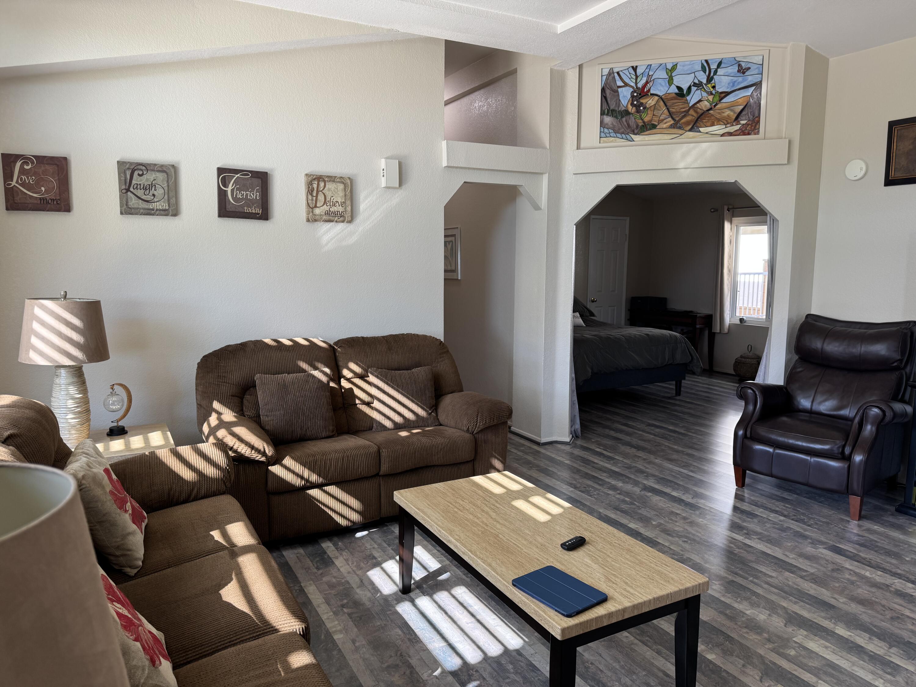 35280 South Border Thousand Palms, CA 92276 - Photo 11 of 50 a living room with furniture and a fireplace