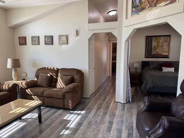 a bedroom with bed and window