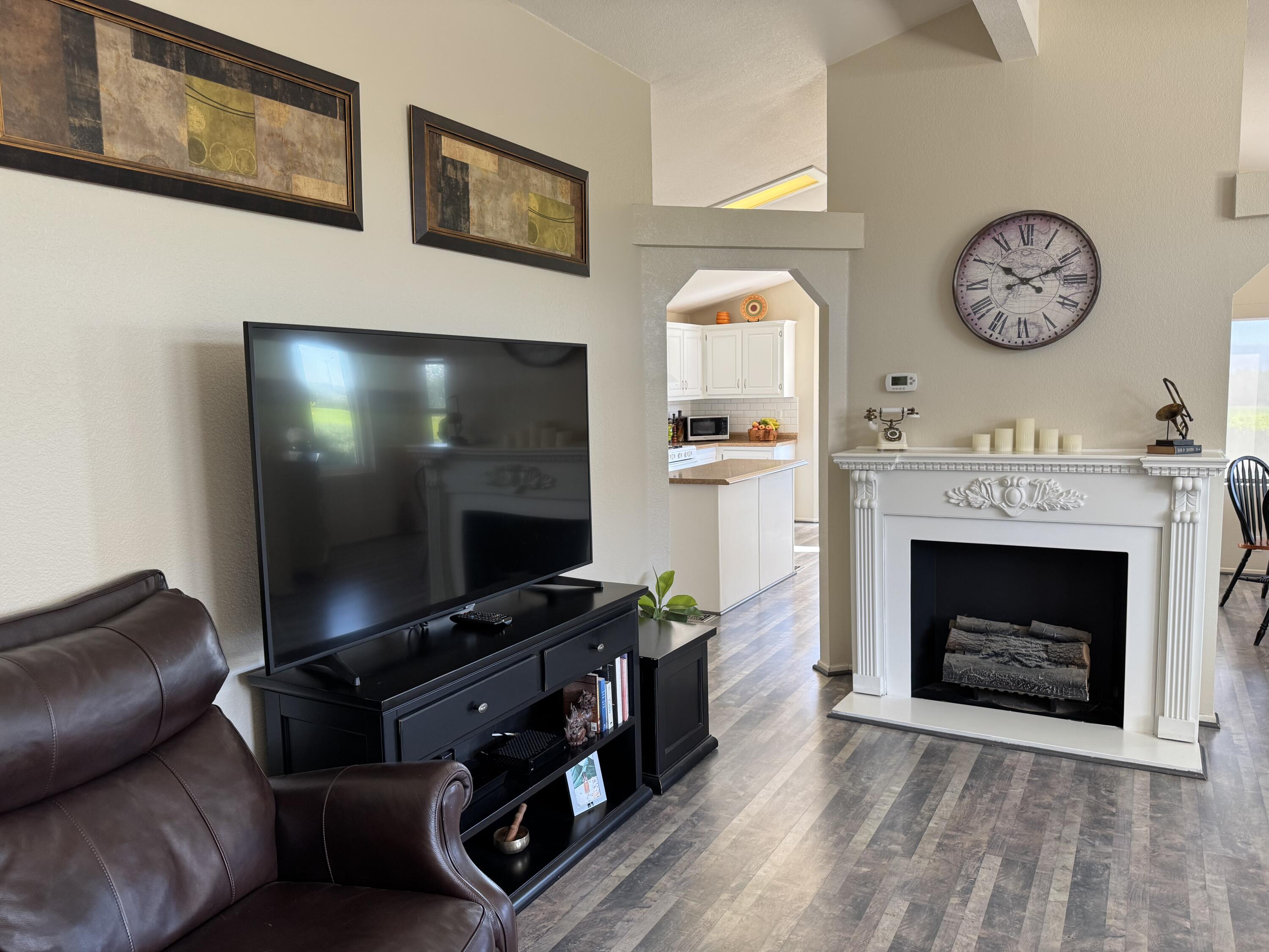 35280 South Border Thousand Palms, CA 92276 - Photo 18 of 50 a living room with furniture a fireplace and a flat screen tv