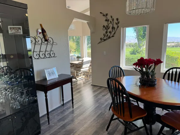 a view of a dining room with furniture window and outside view