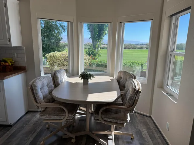 a kitchen with cabinets appliances a sink and a counter top space