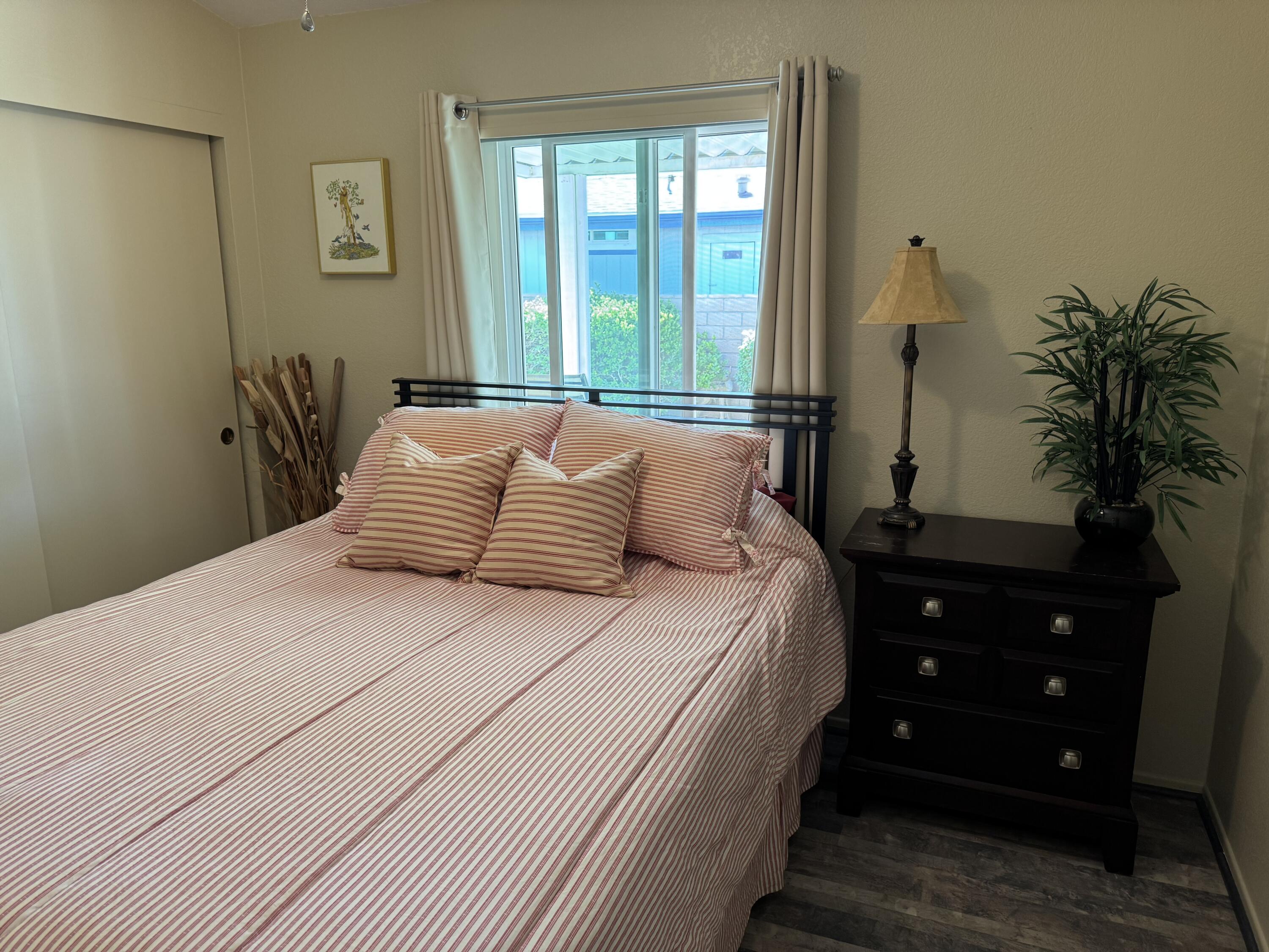35280 South Border Thousand Palms, CA 92276 - Photo 28 of 50 a bedroom with a bed and a potted plant