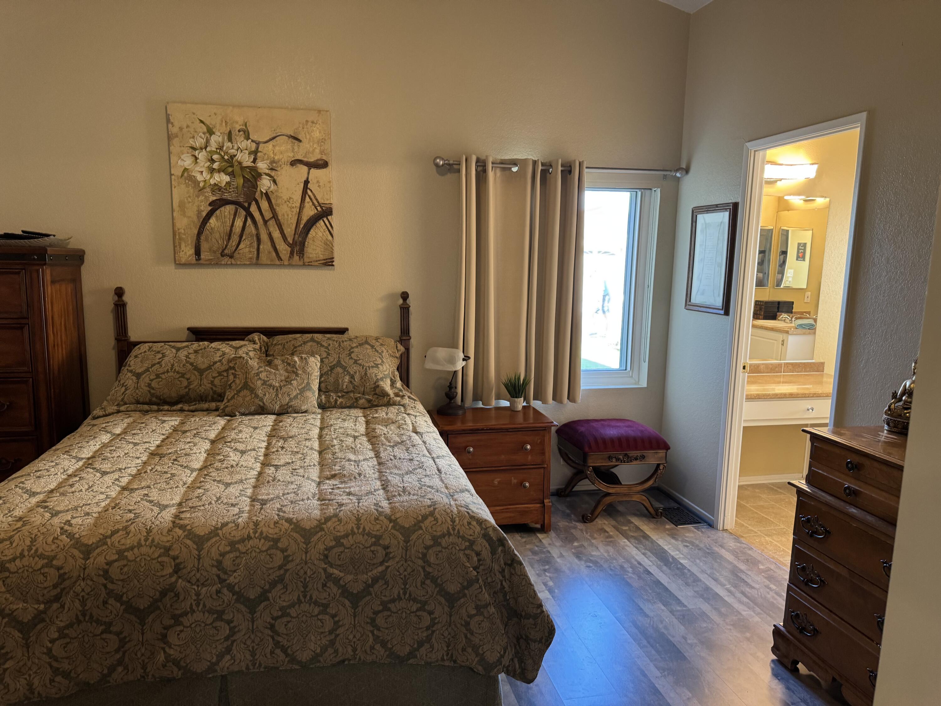 35280 South Border Thousand Palms, CA 92276 - Photo 30 of 50 a bedroom with a bed and wooden floor