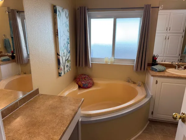 a bathroom with a sink double vanity and a mirror