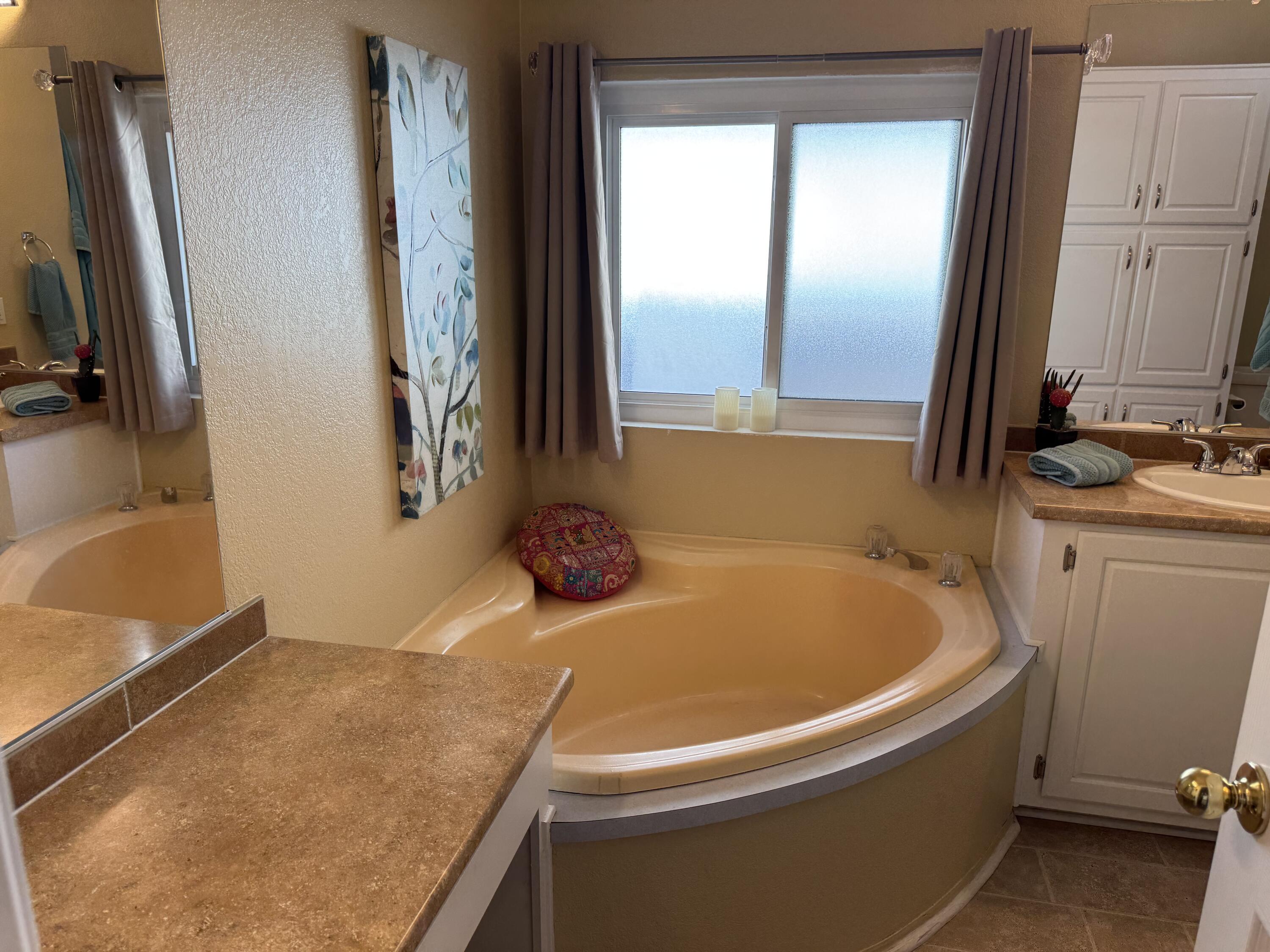 35280 South Border Thousand Palms, CA 92276 - Photo 32 of 50 a bathroom with a tub and a sink