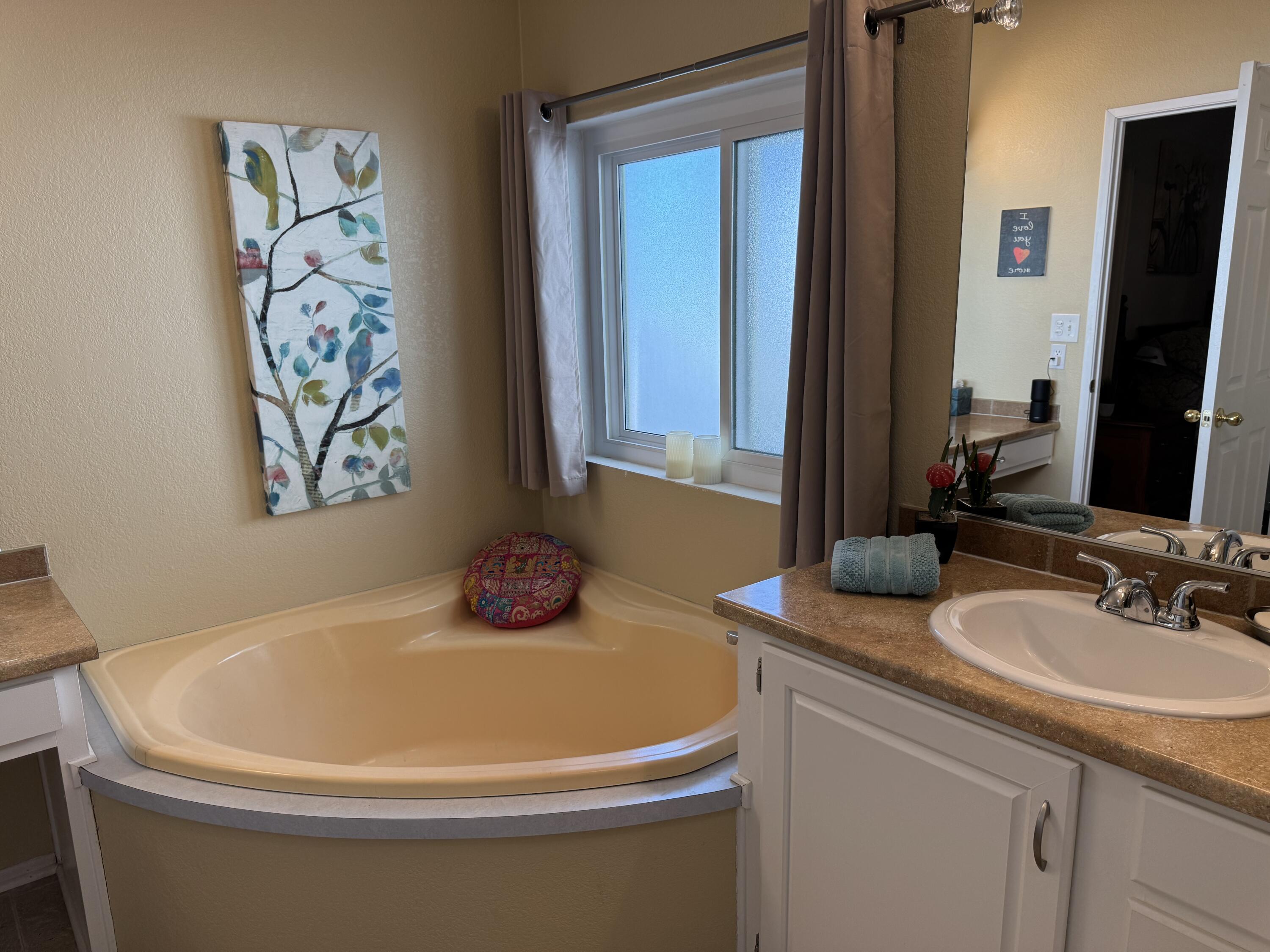 35280 South Border Thousand Palms, CA 92276 - Photo 35 of 50 a bathroom with a tub and sink