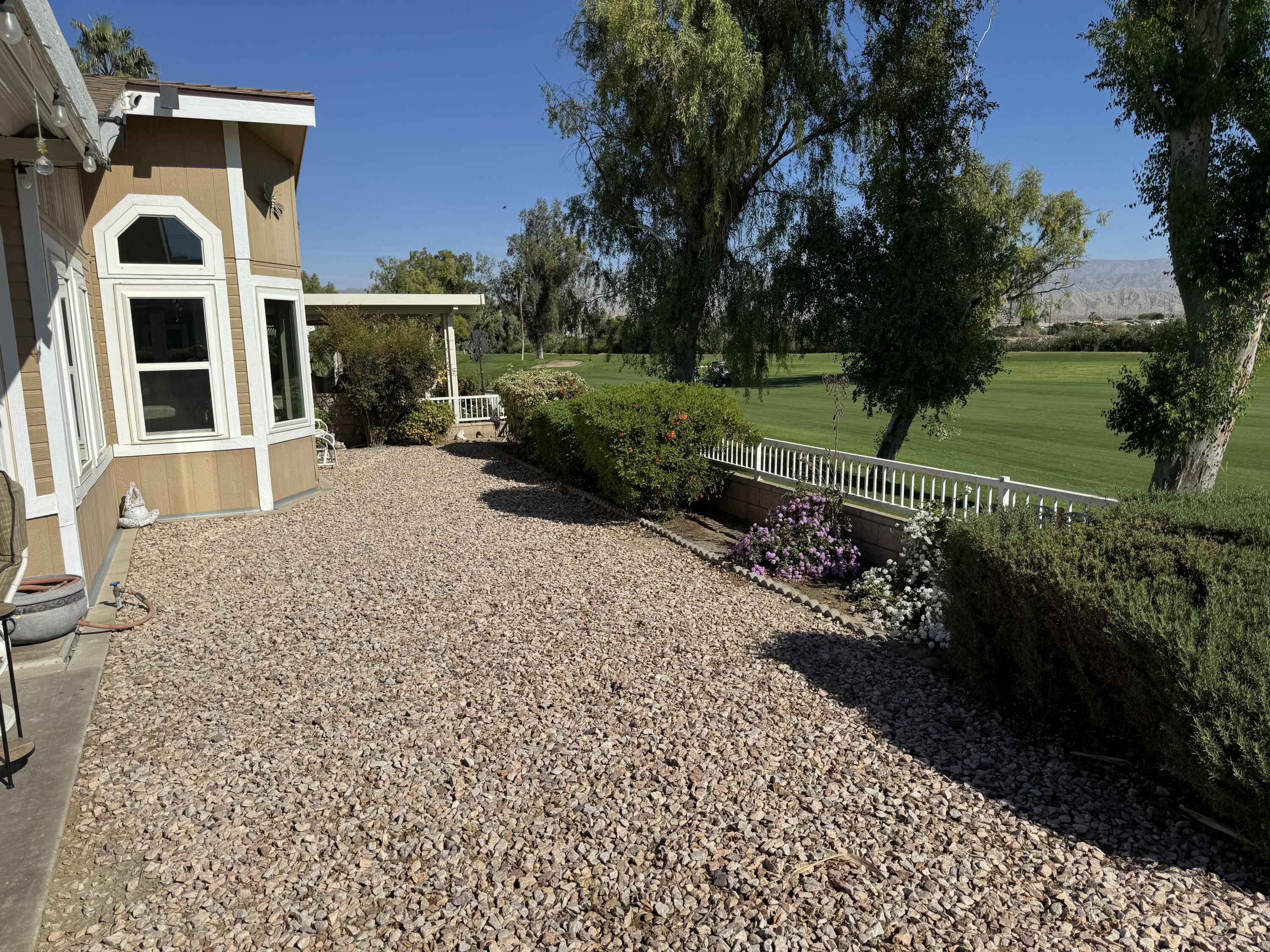 35280 South Border Thousand Palms, CA 92276 - Photo 6 of 50 a front view of a house with a garden