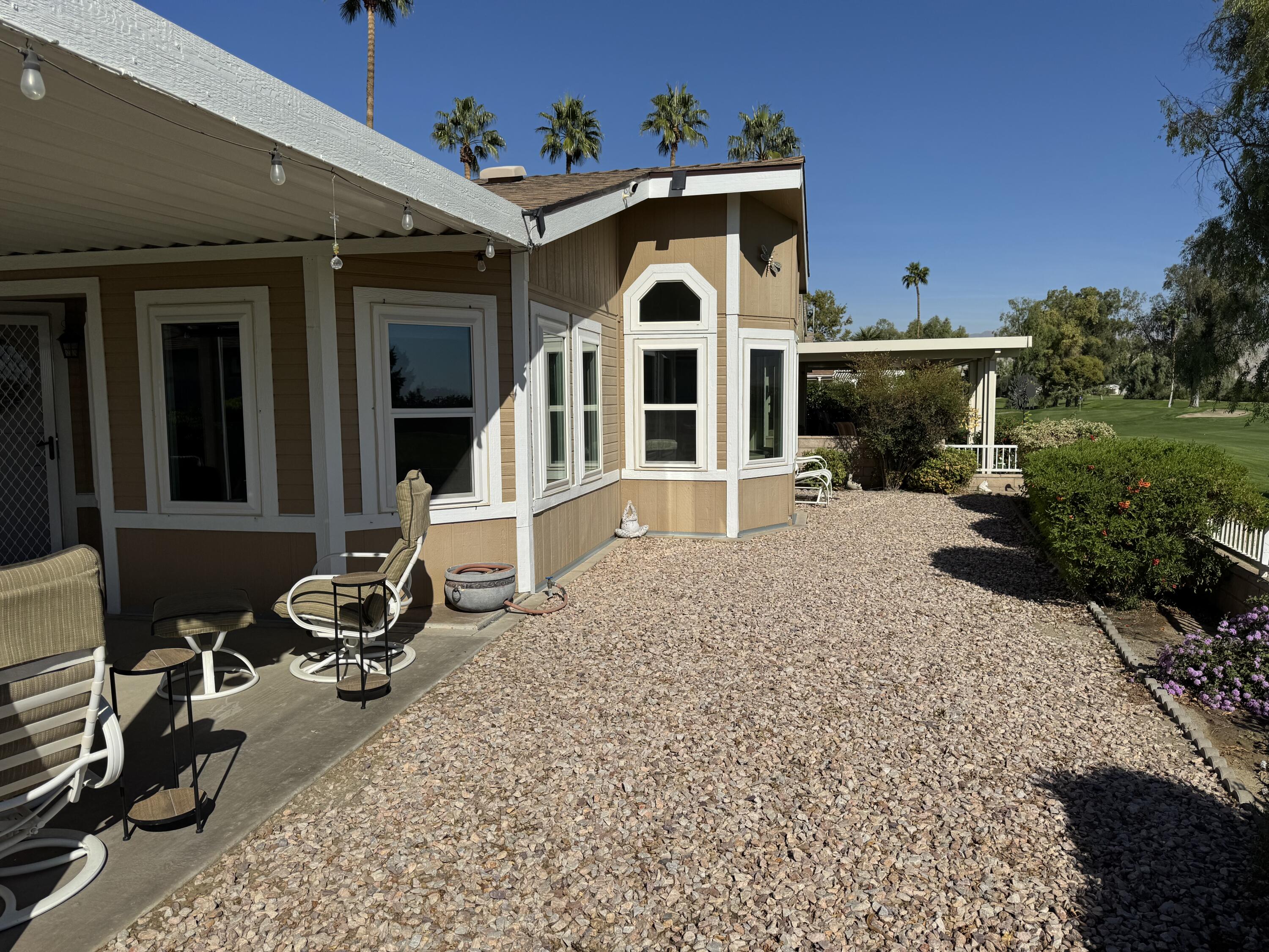 35280 South Border Thousand Palms, CA 92276 - Photo 9 of 50 a front view of a house with garden