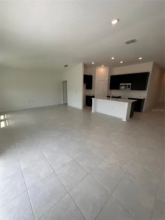a view of kitchen with furniture and window