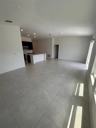 a view of kitchen with windows and stairs