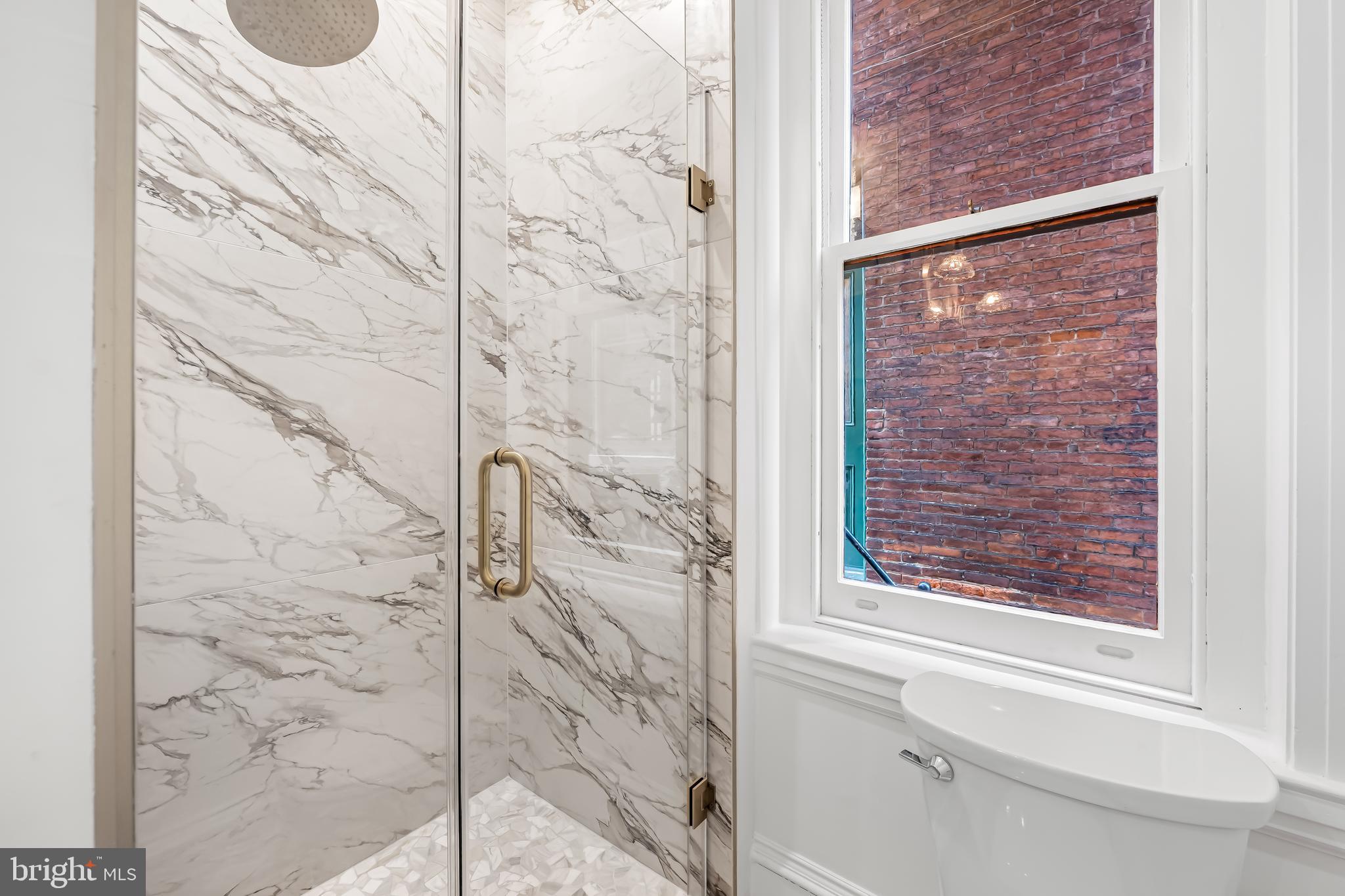 1202 Bolton Street, Unit 1 Baltimore, MD 21217 - Photo 13 of 22 a bathroom with a shower