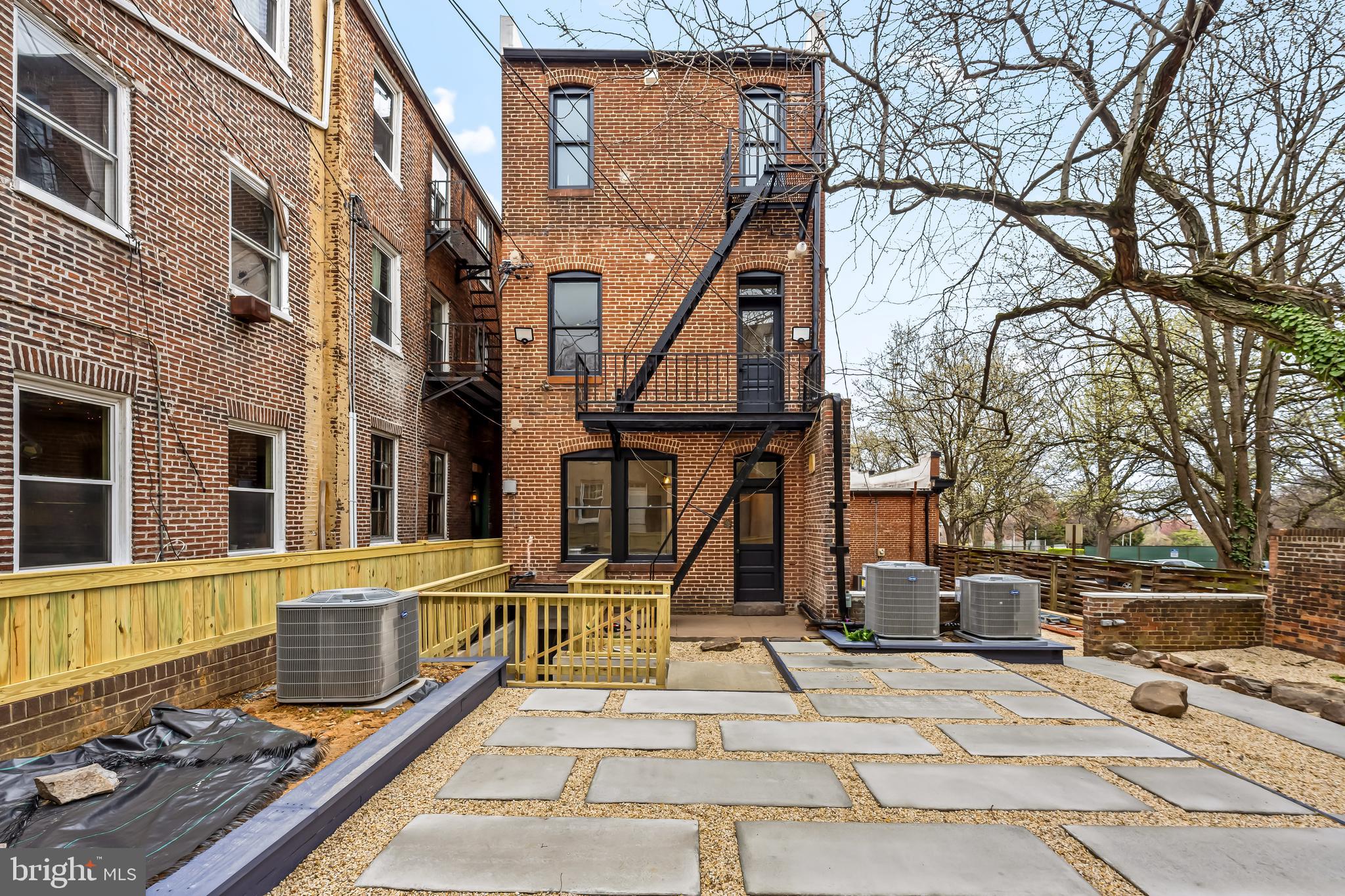1202 Bolton Street, Unit 1 Baltimore, MD 21217 - Photo 20 of 22 a front view of a building with street