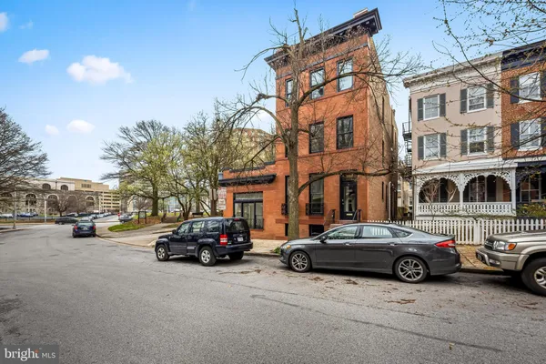 a view of a cars parked in front of a building