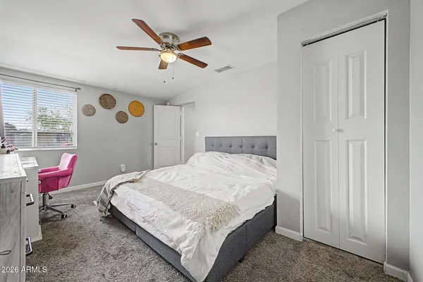 a bedroom with a bed and furniture