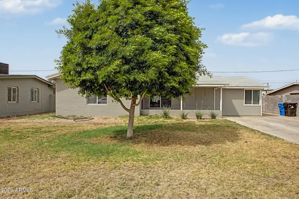 a house with a tree in front of it