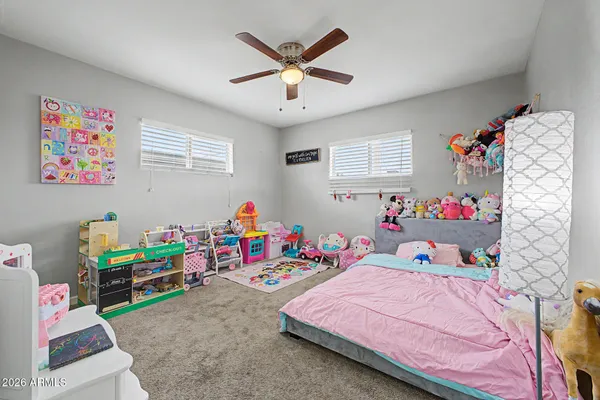 a bed room with a bed and a window