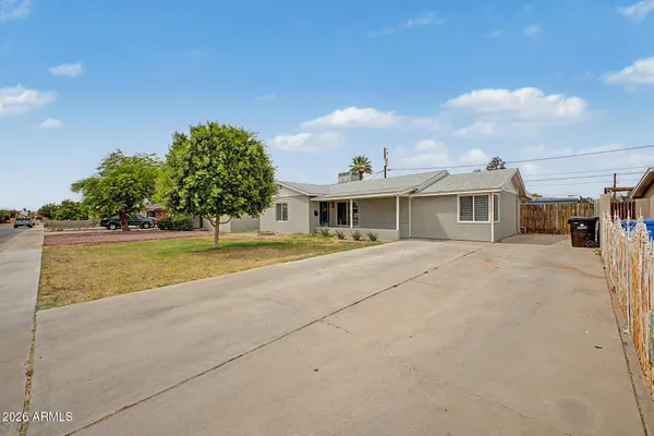a house with swimming pool in front of it