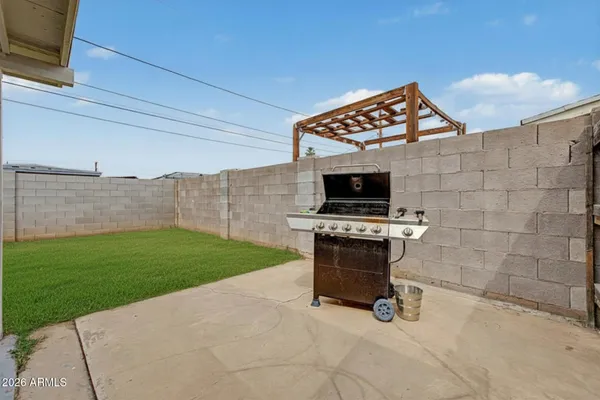 a view of a kitchen with a sink and a fireplace
