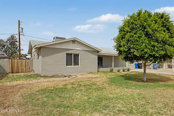 a house with trees in the background