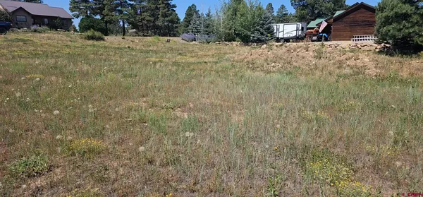 a pathway of a house with a yard