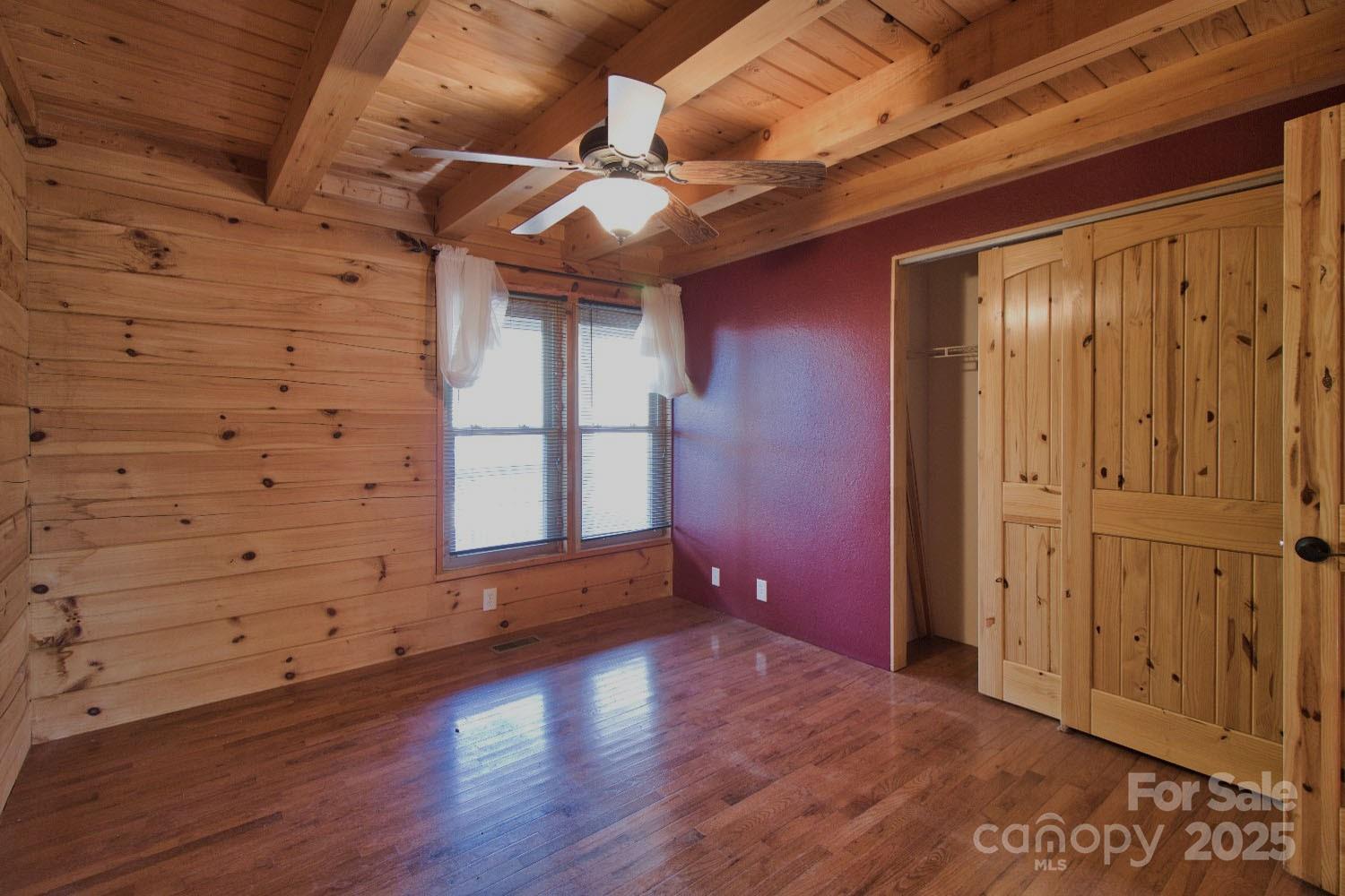 155 Northridge Drive, Unit 79 Rutherfordton, NC 28139 - Photo 11 of 31 an empty room with wooden floor and windows