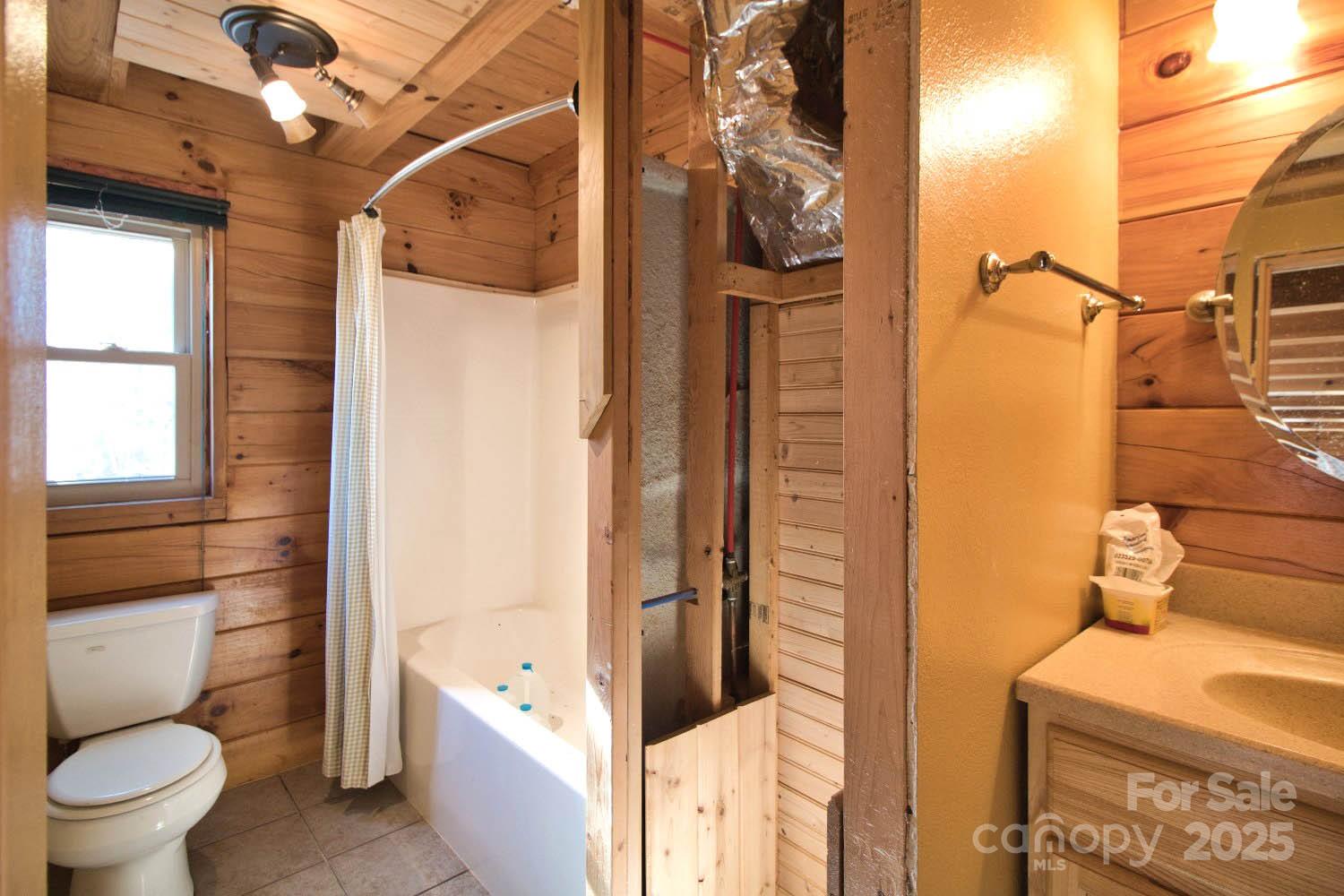 155 Northridge Drive, Unit 79 Rutherfordton, NC 28139 - Photo 12 of 31 a bathroom with a toilet and a shower