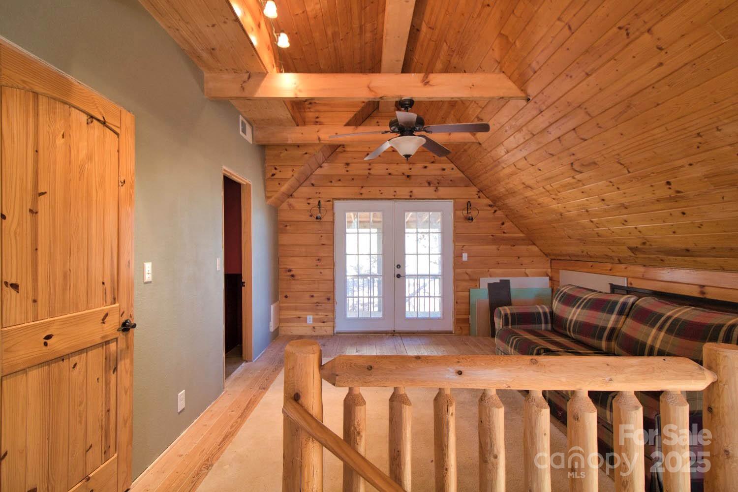 155 Northridge Drive, Unit 79 Rutherfordton, NC 28139 - Photo 15 of 31 a bedroom with a bed and a chandelier