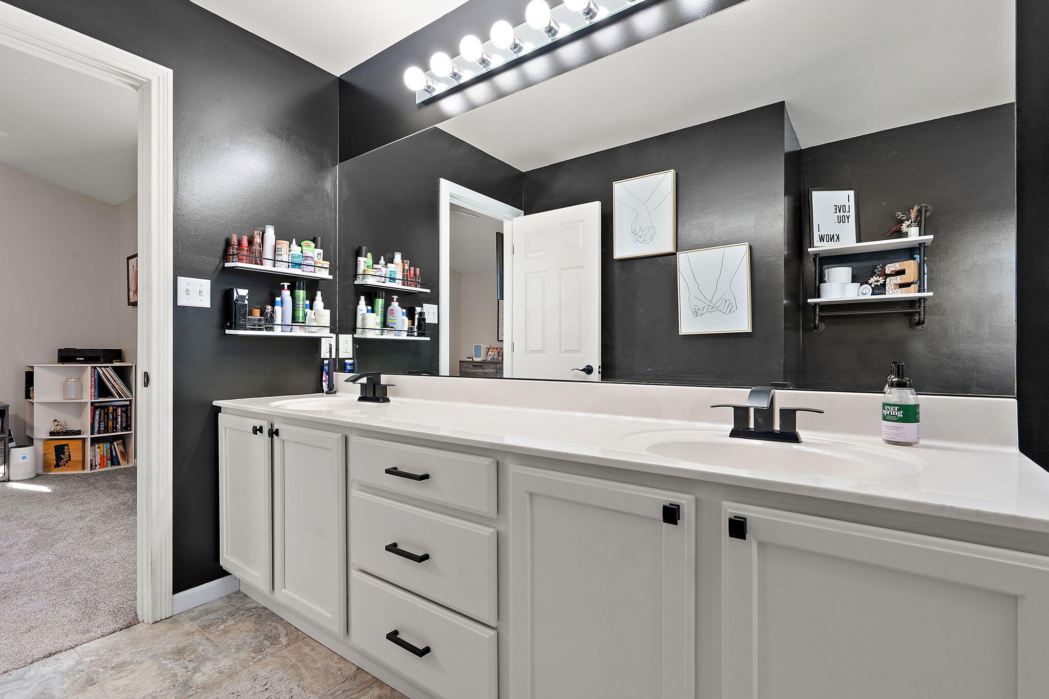 696 Admiral Drive Porter, IN 46304 - Photo 15 of 27 a bathroom with a double vanity sink and a mirror