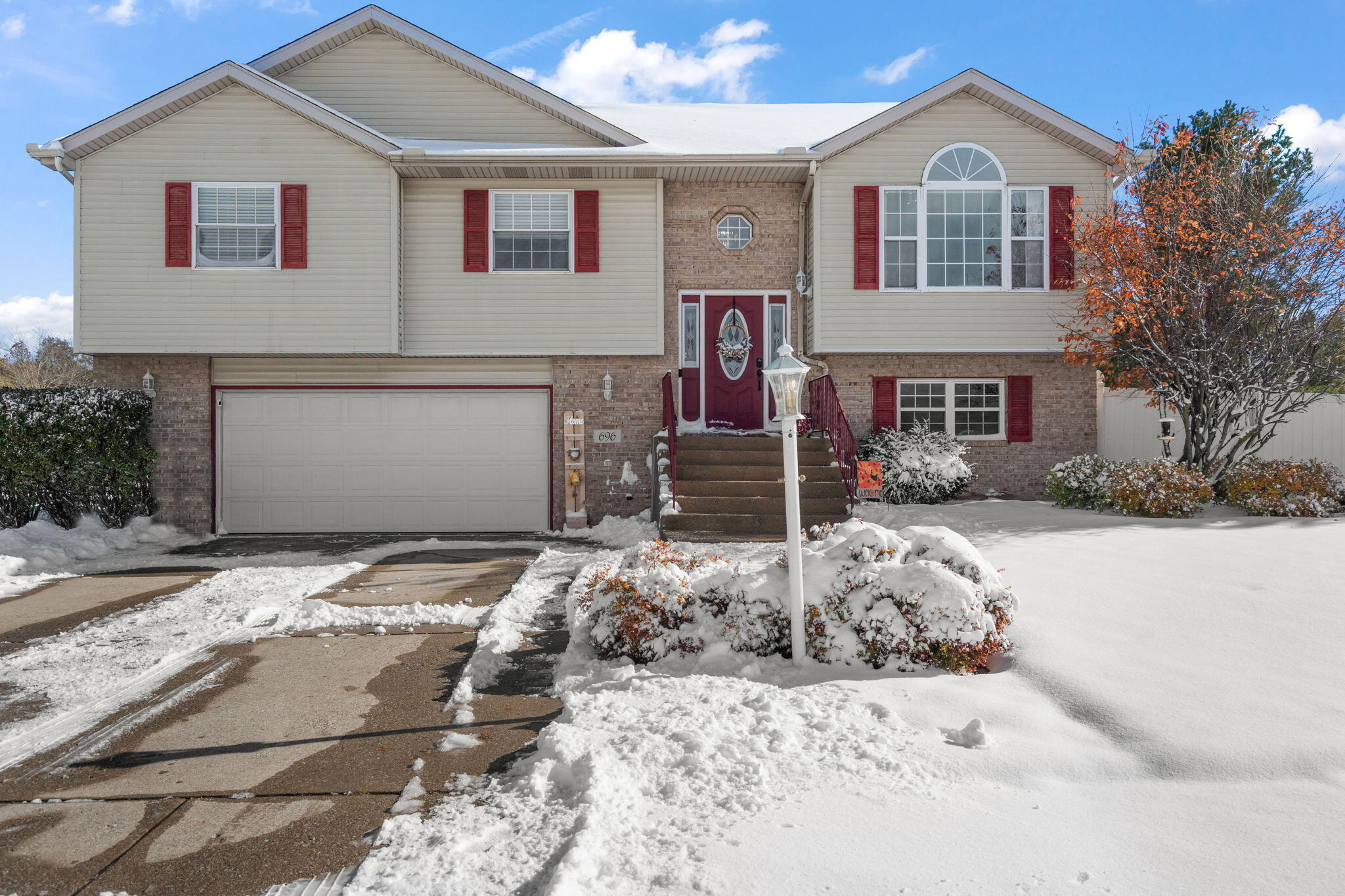 696 Admiral Drive Porter, IN 46304 - Photo 2 of 27 a view of a white house with a yard and large tree