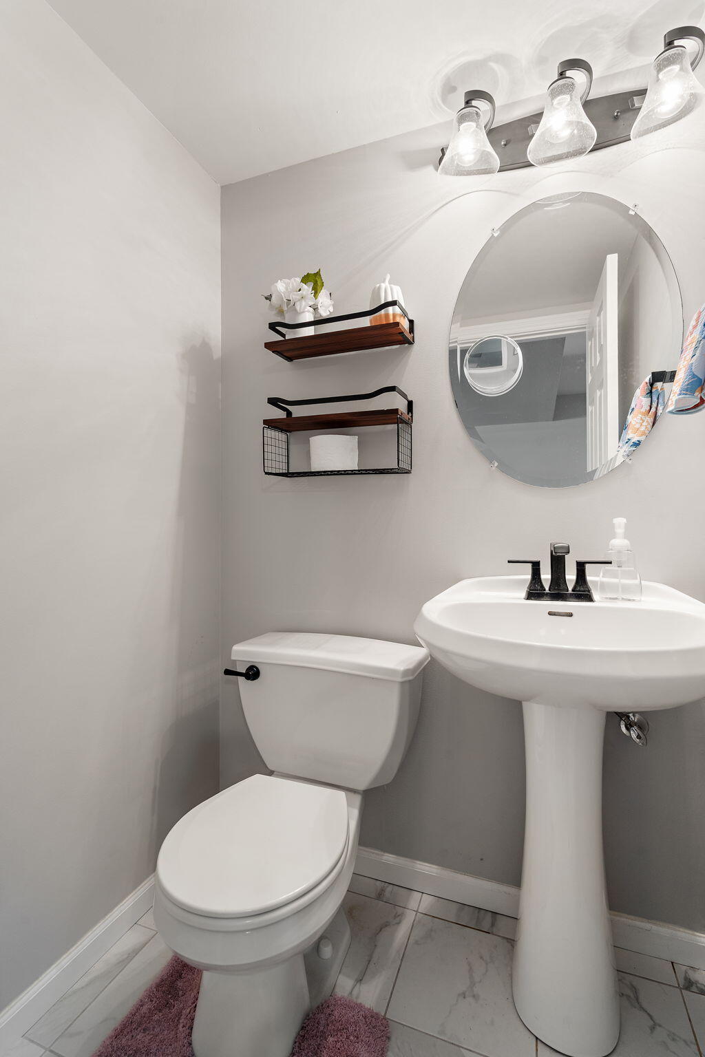 696 Admiral Drive Porter, IN 46304 - Photo 22 of 27 a bathroom with a sink a toilet and mirror
