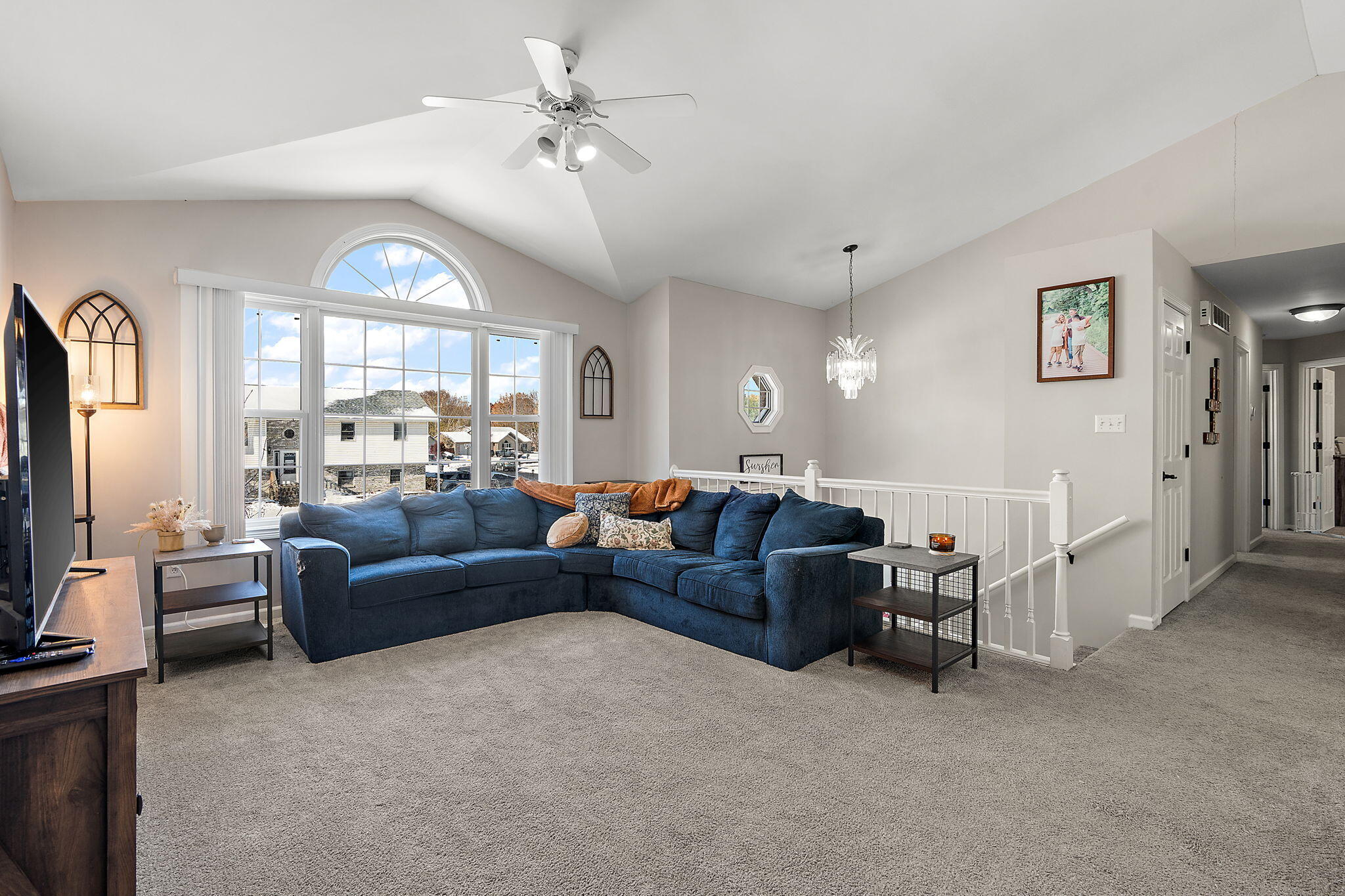 696 Admiral Drive Porter, IN 46304 - Photo 5 of 27 a living room with furniture a large window and a flat screen tv