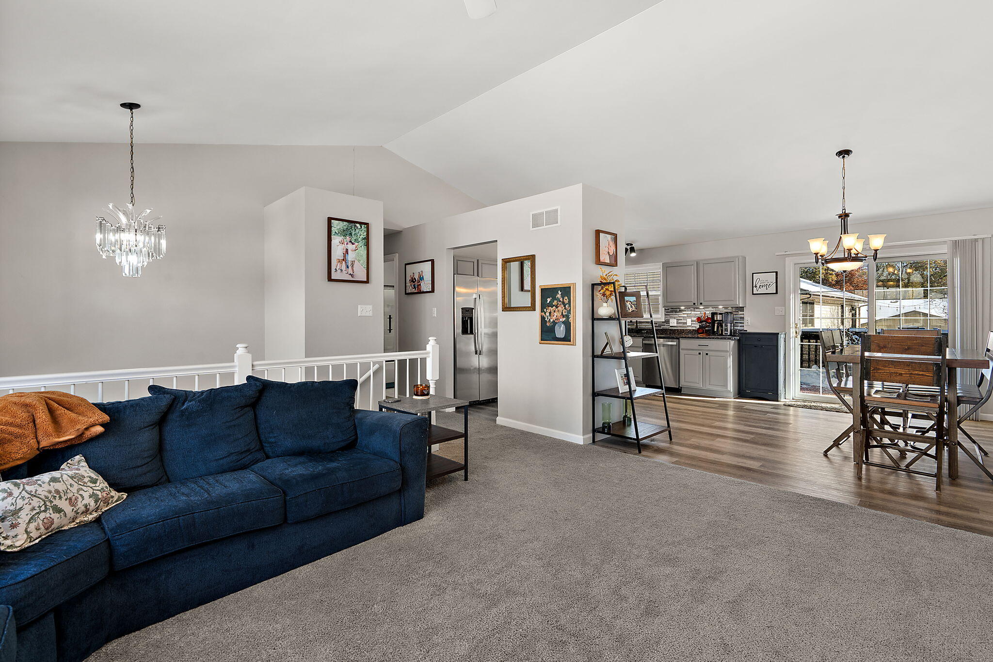 696 Admiral Drive Porter, IN 46304 - Photo 6 of 27 a living room with furniture and a dining table with kitchen view