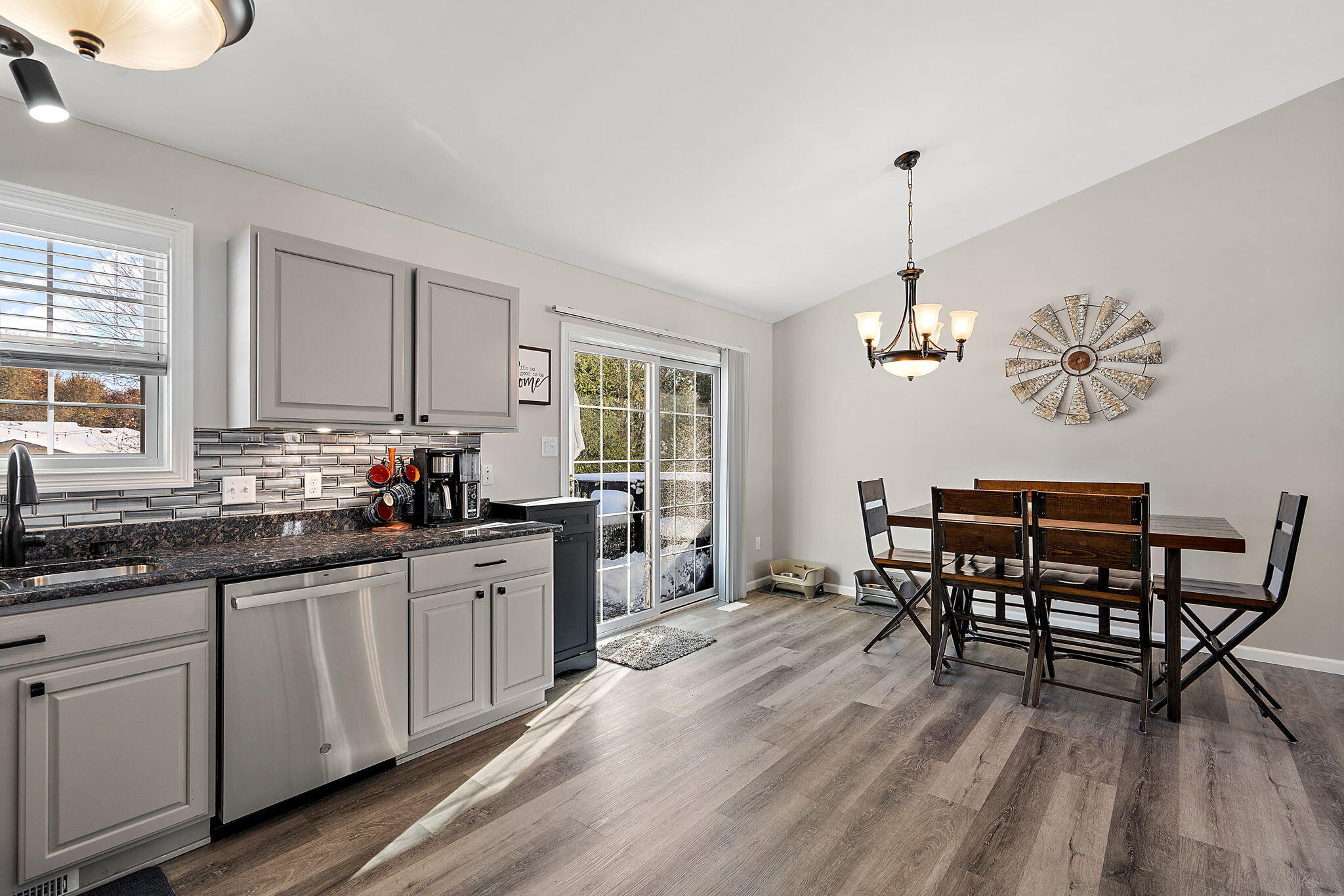 696 Admiral Drive Porter, IN 46304 - Photo 9 of 27 a kitchen with stainless steel appliances a dining table chairs and wooden floor
