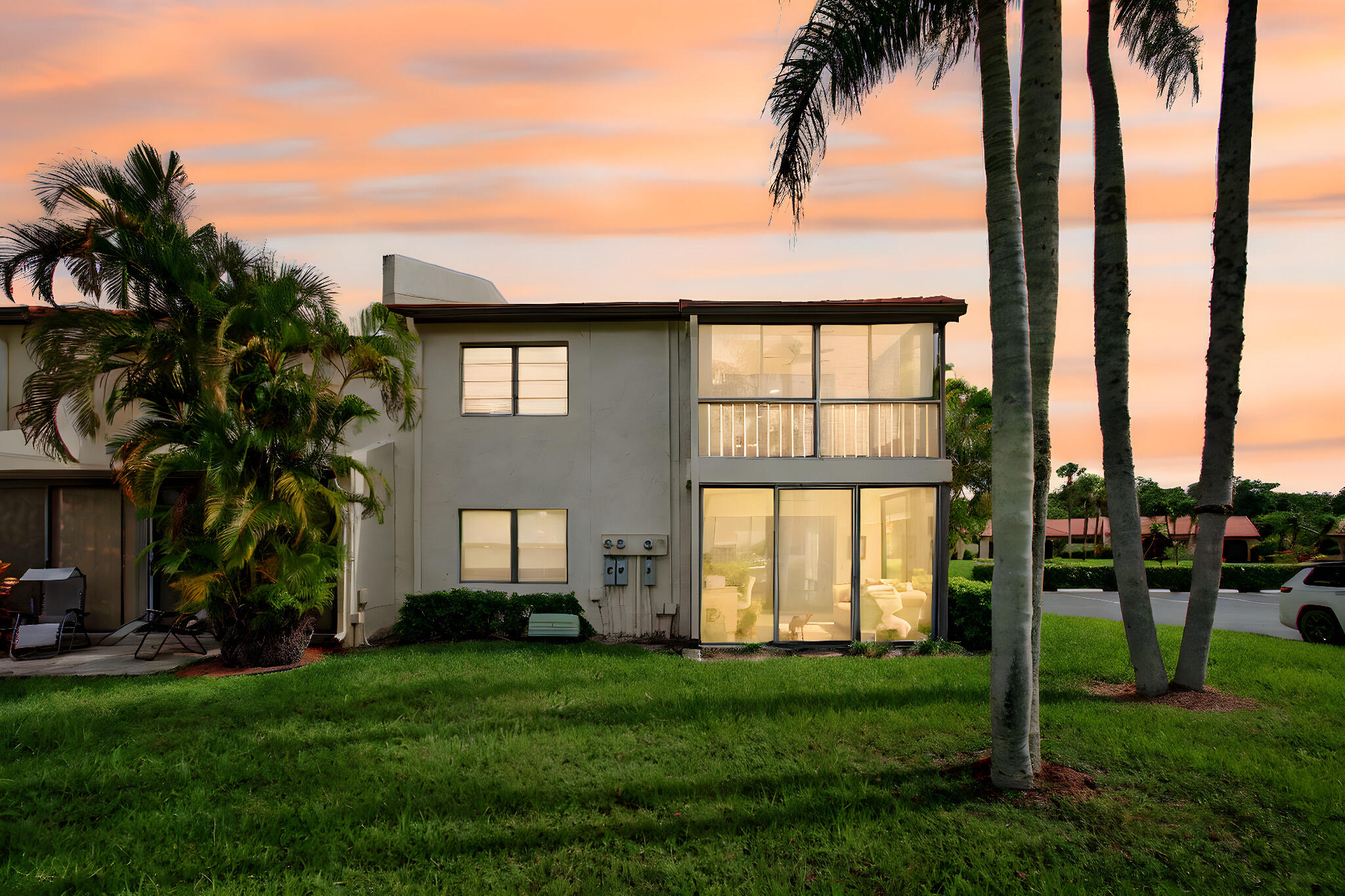 8536 Casa Del Lago, Unit 49B Boca Raton, FL 33433 - Photo 78 of 79 a front view of a house with a garden and yard