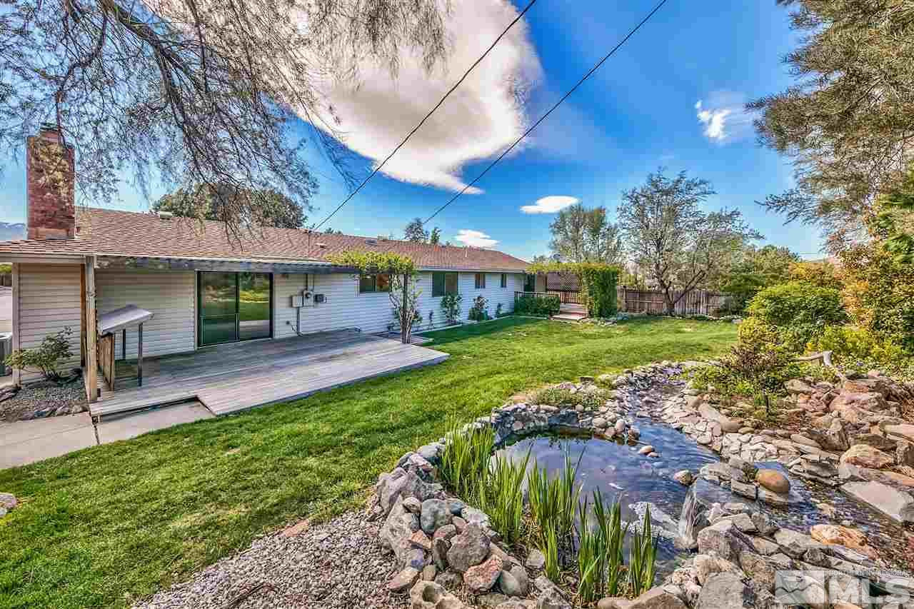 13790 Rancheros Drive Reno, NV 89521 - Photo 1 of 22 a view of a house with a yard