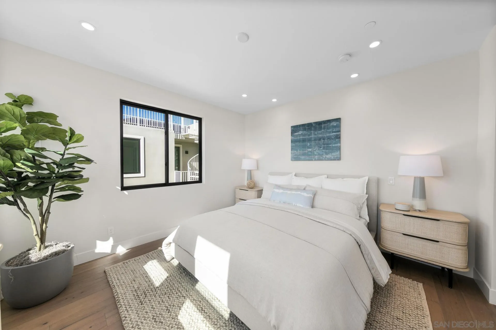 1756 Whaley Street Oceanside, CA 92054 - Photo 17 of 47 a bedroom with bed and a couch