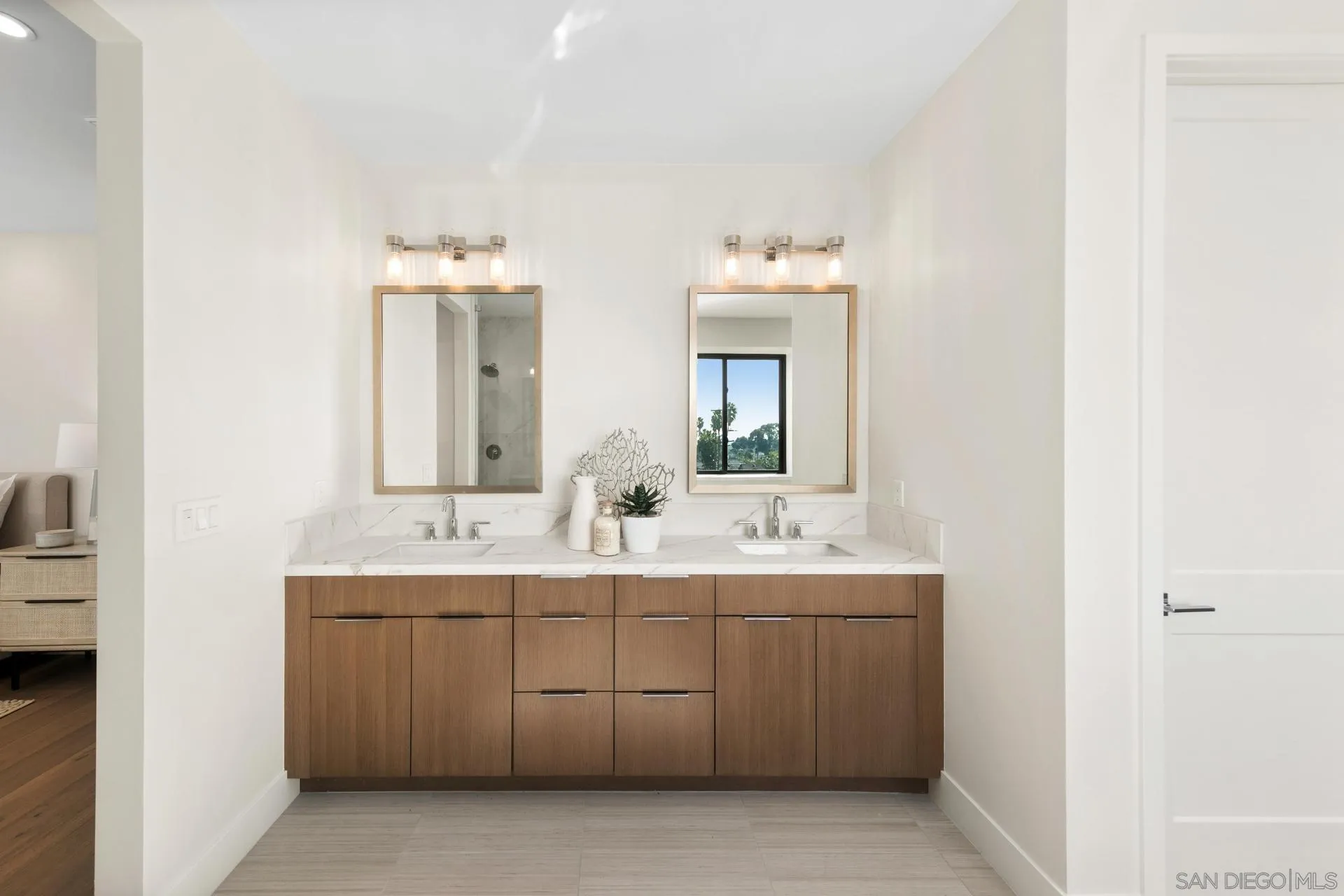 1756 Whaley Street Oceanside, CA 92054 - Photo 20 of 47 a en suite bathroom with a double vanity sink and mirror