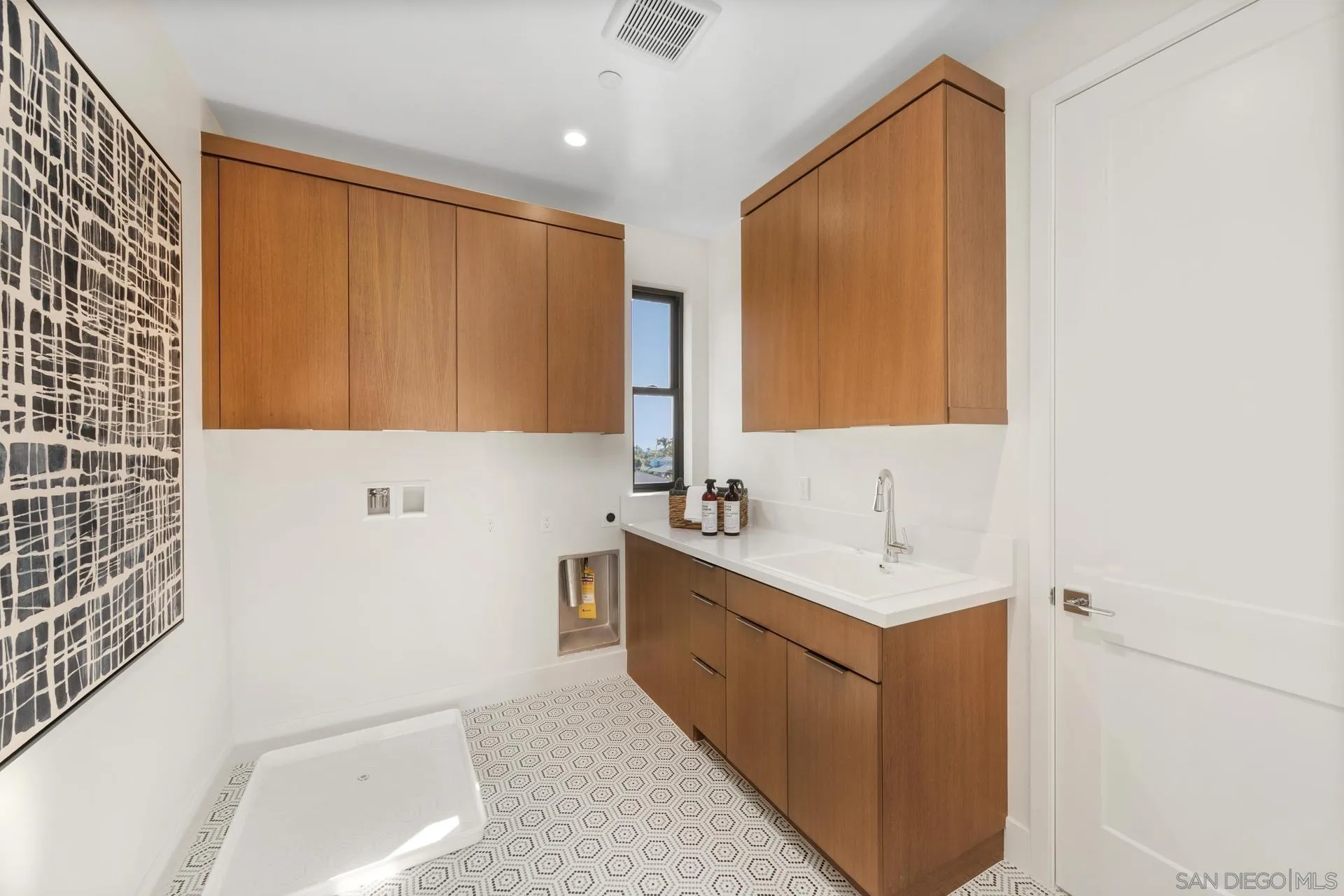 1756 Whaley Street Oceanside, CA 92054 - Photo 30 of 47 a bathroom with a sink a mirror and a bathtub