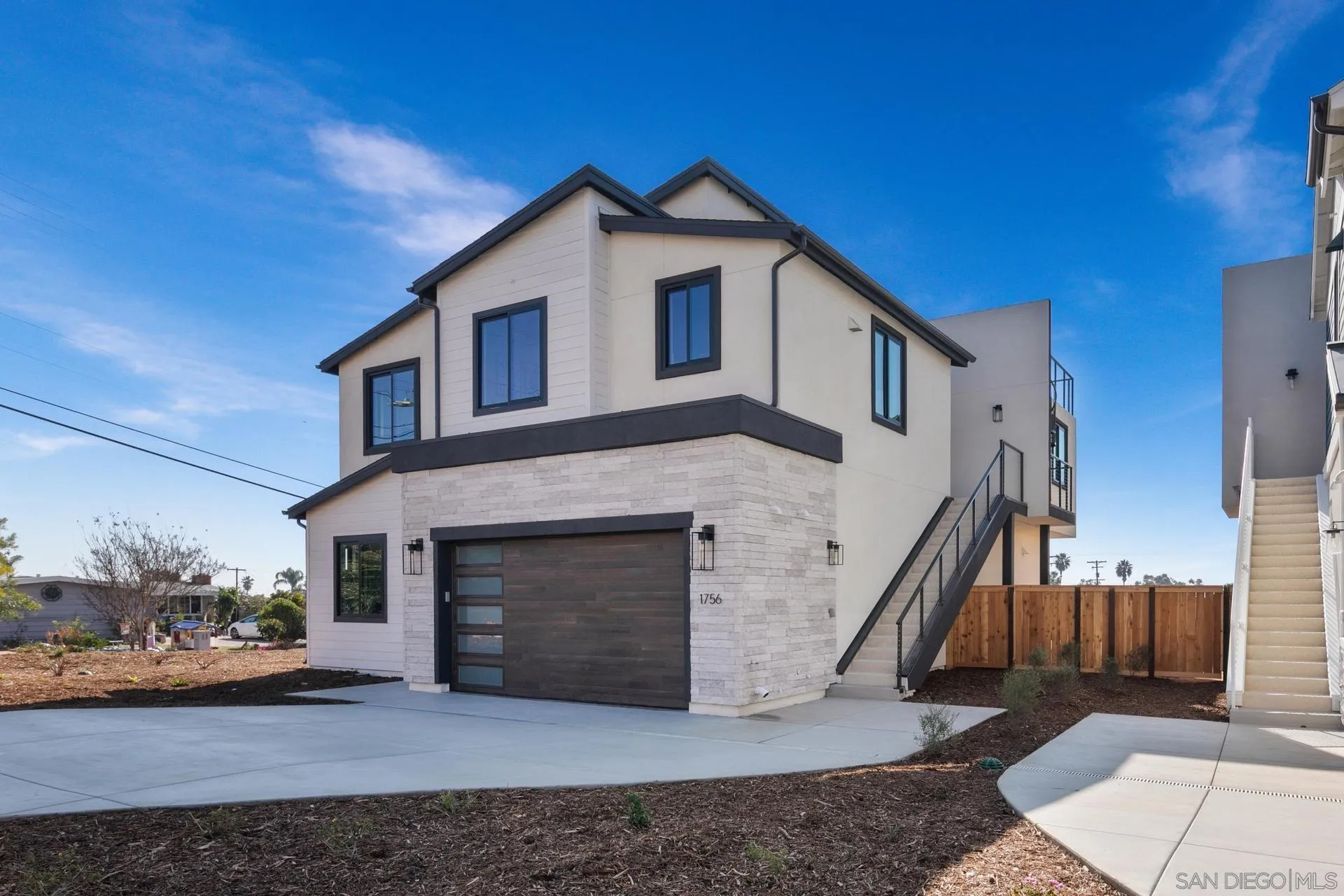 1756 Whaley Street Oceanside, CA 92054 - Photo 3 of 47 a front view of a house with a yard