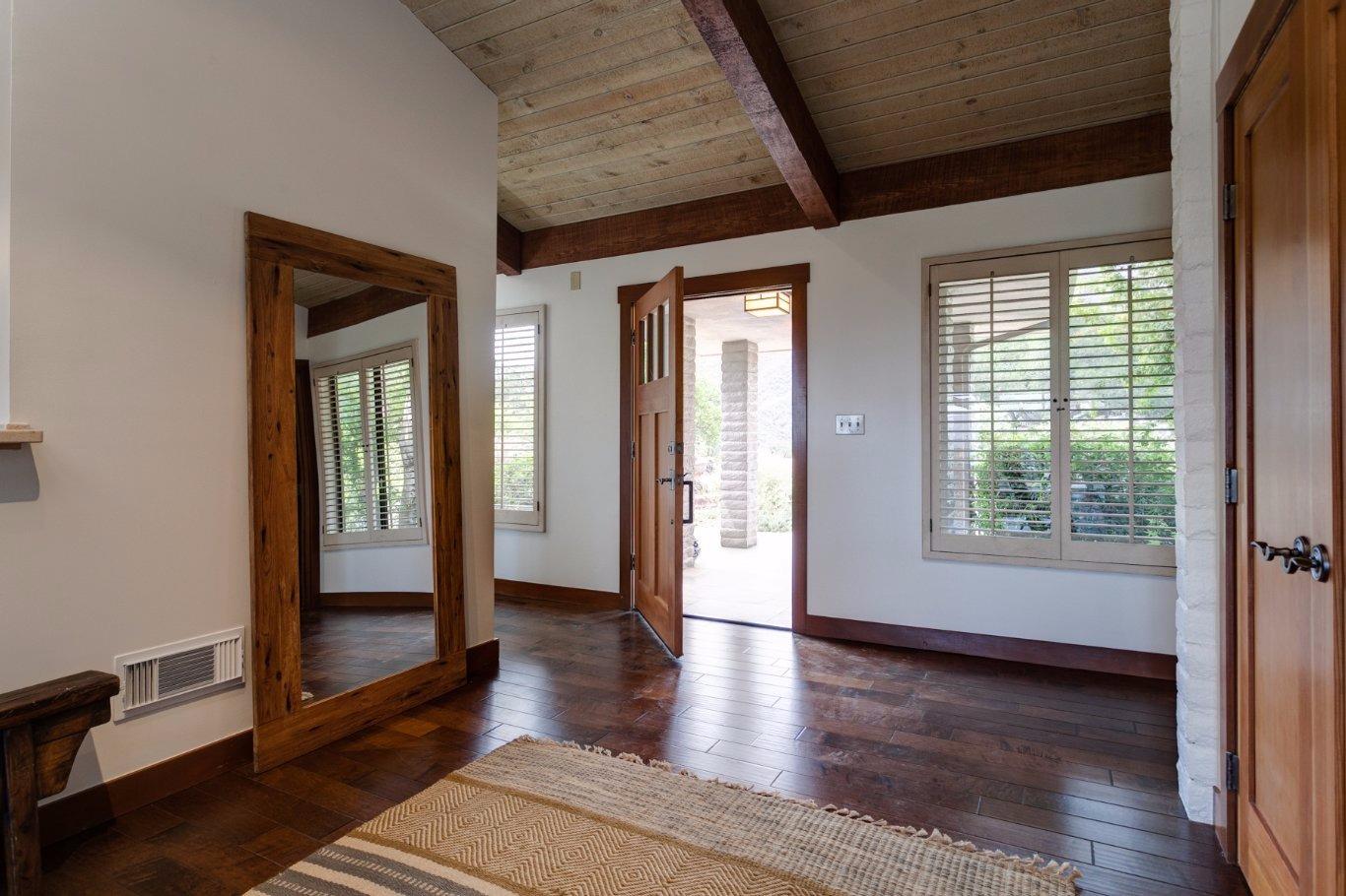 260 Running Ridge Trail Ojai, CA 93023 - Photo 7 of 50 an empty room with wooden floor and windows