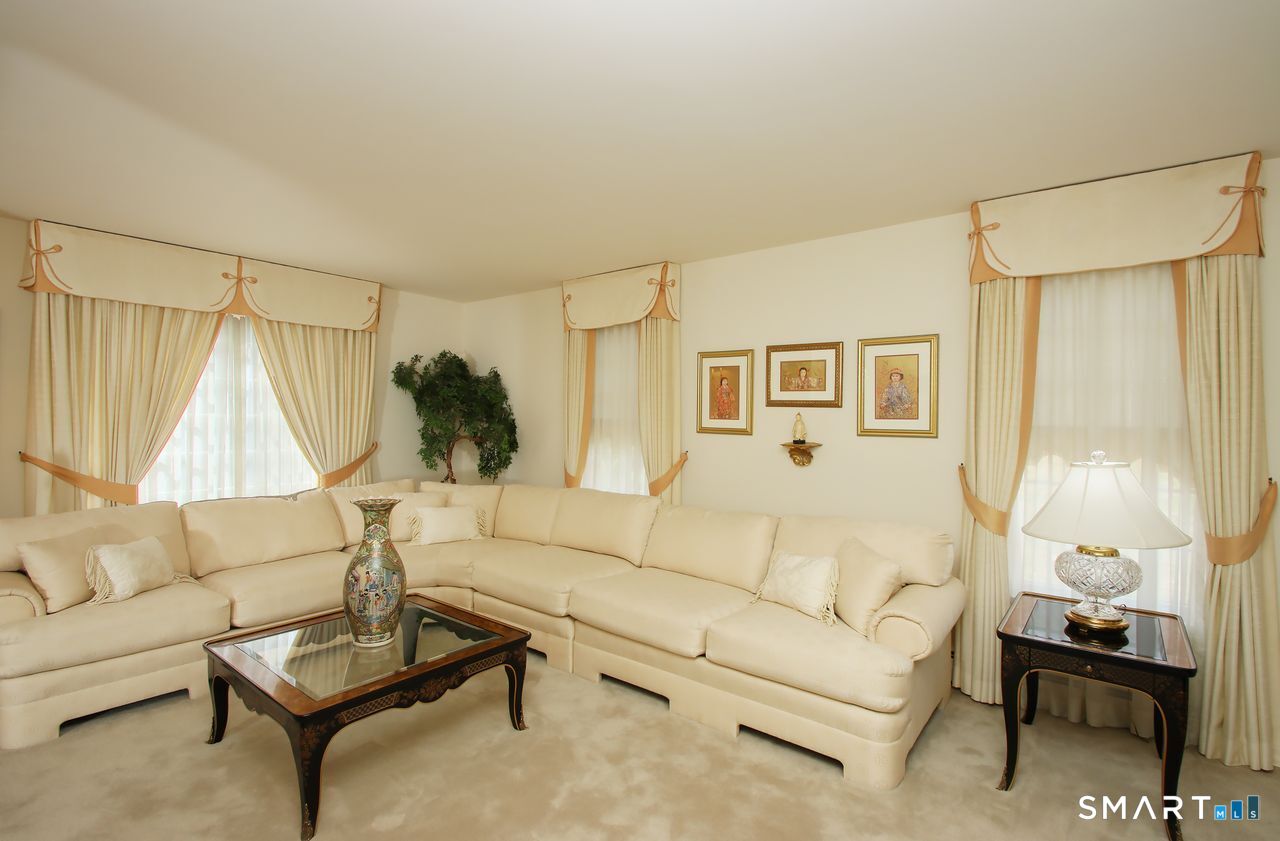 370 Opening Hill Road Madison, CT 06443 - Photo 4 of 27 Spacious Living with wall to wall carpeting which is ontop of hardwood floor