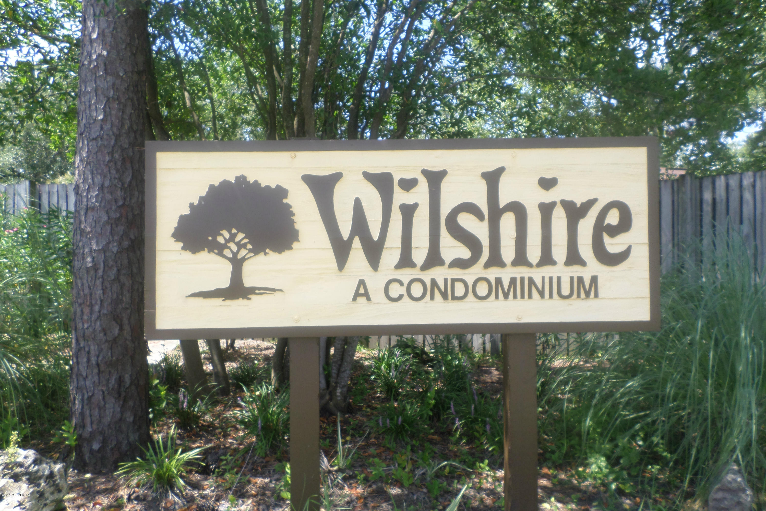 4822 Windrush Lane Jacksonville, FL 32217 - Photo 20 of 23 a sign broad on the side of the road