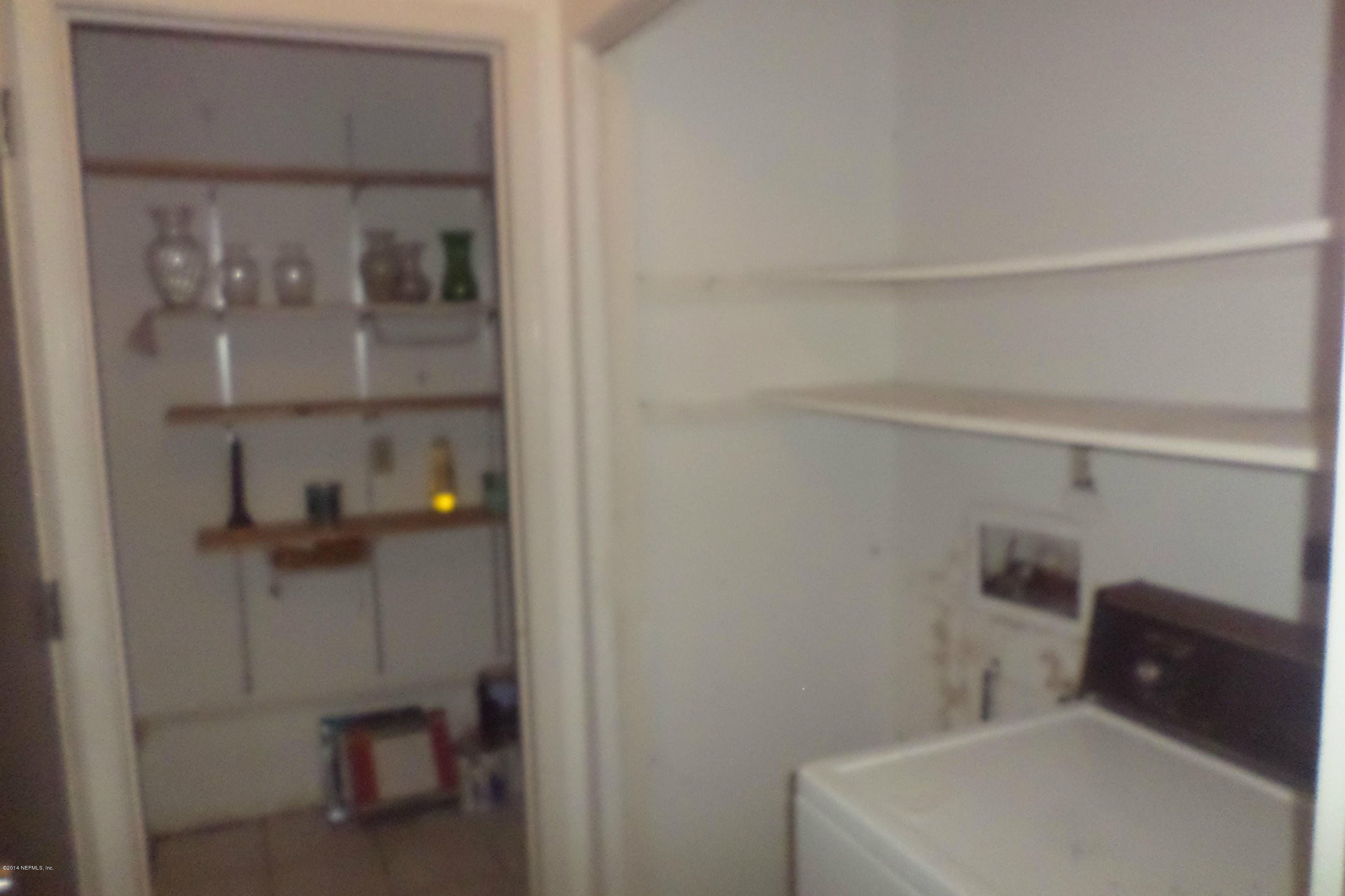 4822 Windrush Lane Jacksonville, FL 32217 - Photo 21 of 23 a bathroom with a toilet