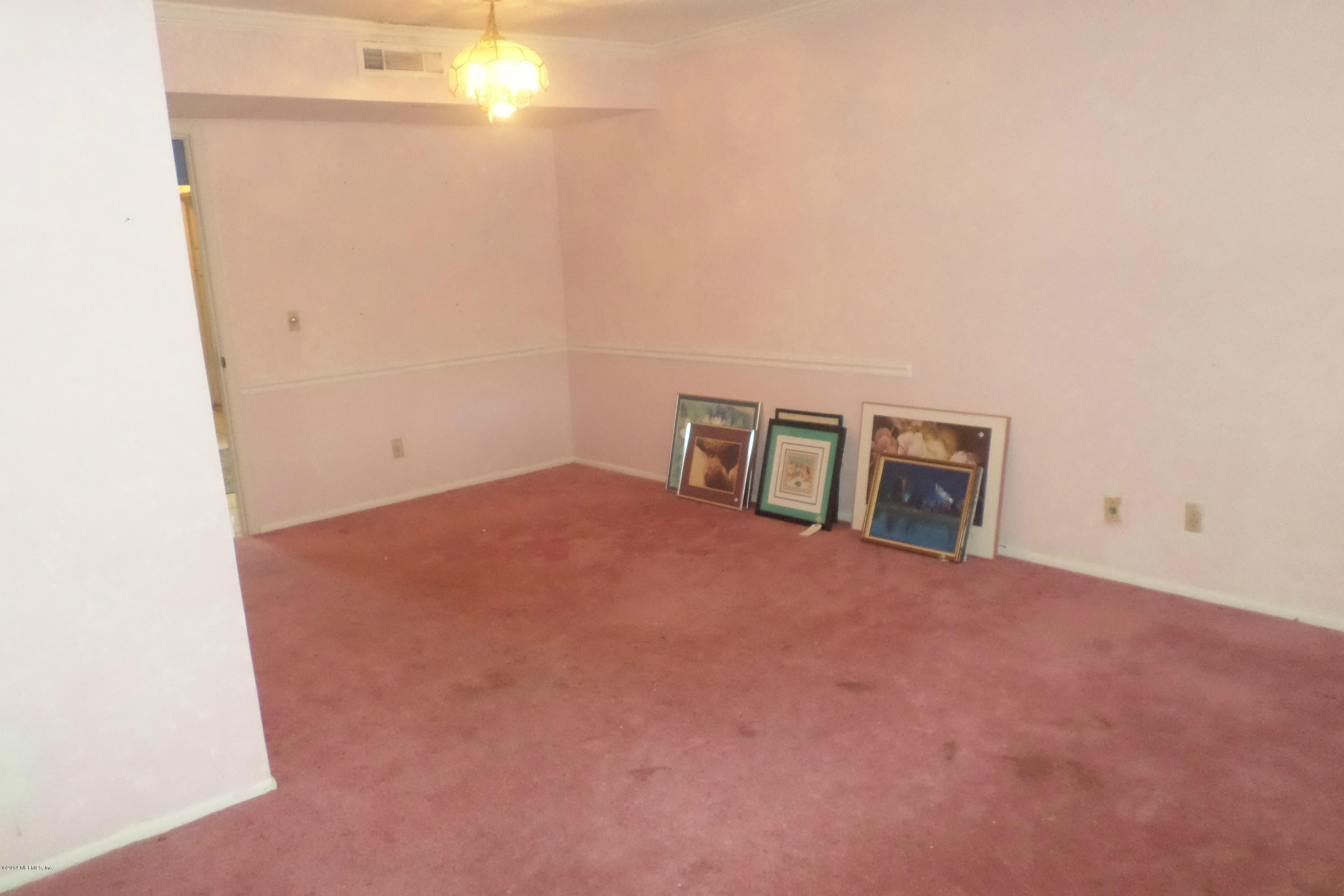 4822 Windrush Lane Jacksonville, FL 32217 - Photo 3 of 23 a view of an empty room with a window