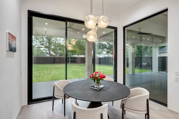 a kitchen with stainless steel appliances kitchen island granite countertop a refrigerator and a sink