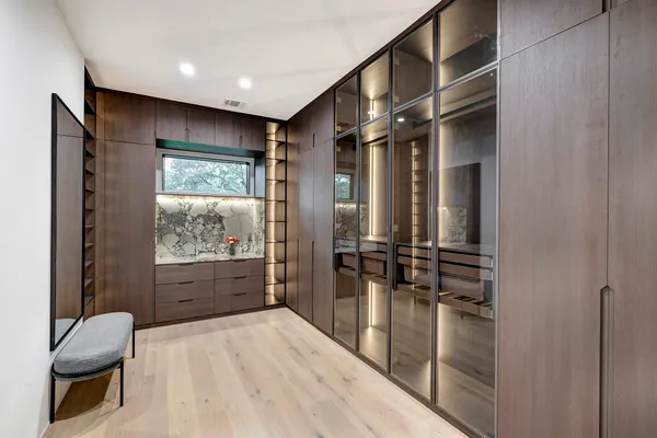 a bathroom with a double vanity sink mirror and shower
