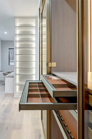 a bathroom with a granite countertop sink a toilet and mirror
