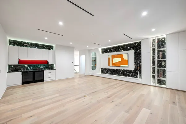 a view of an empty room with a sliding door