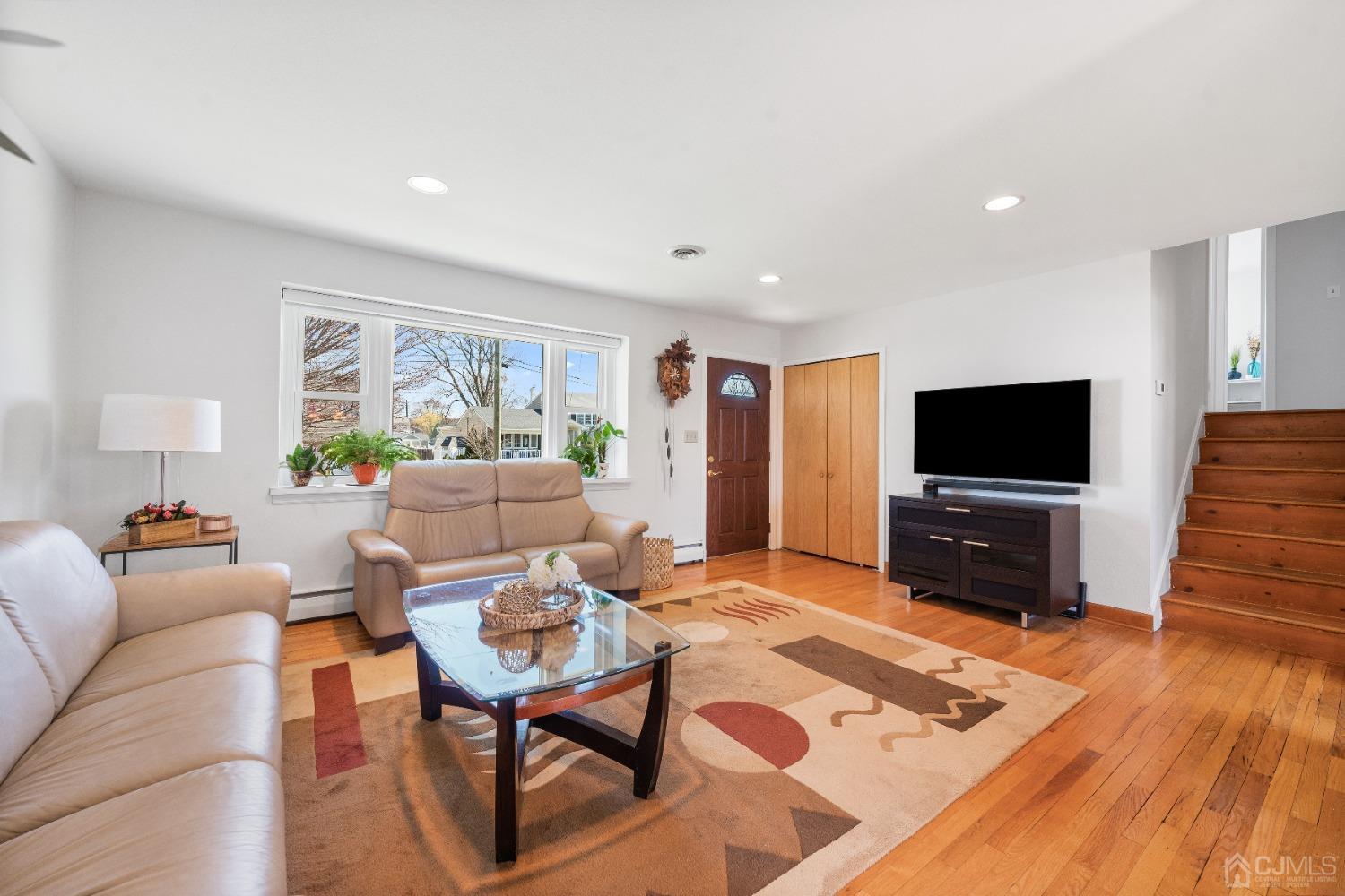 22 Baldwin Road Edison, NJ 08817 - Photo 11 of 30 a living room with furniture and a flat screen tv