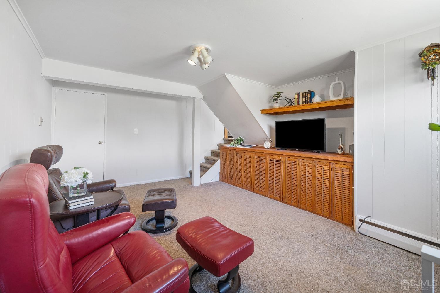 22 Baldwin Road Edison, NJ 08817 - Photo 14 of 30 a living room with furniture and a flat screen tv